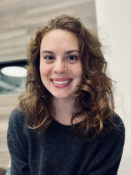 Smiling woman with long brown hair