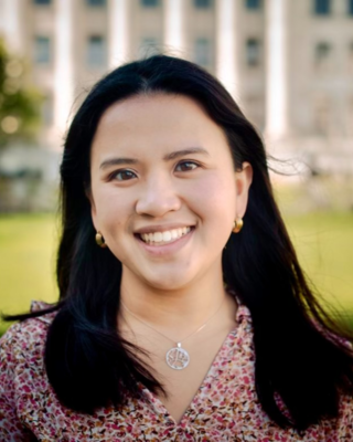 Woman with brown hair smiling 