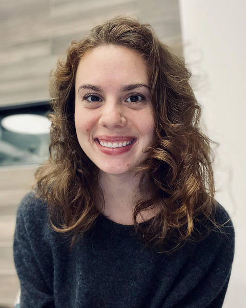 Smiling woman with long brown hair